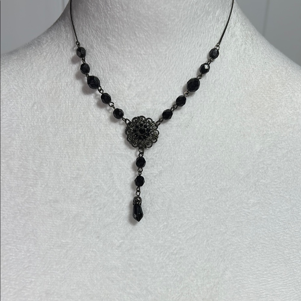 V neck beaded necklace on black gun toned necklace